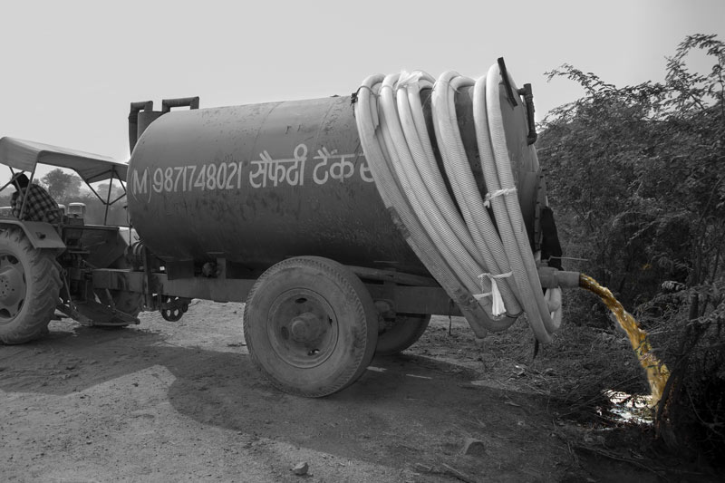 A sewage tanker emptying into Najafgarh Nala –a stormwater drain - in South-West district, National Capital Territory of Delhi